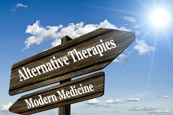 Alternative Therapies Modern Medicines crossroads sign